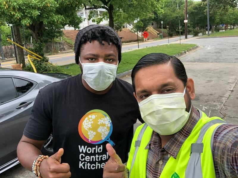 Ackeem Evans (left) with a World Central Kitchen volunteer. Evans is the Georgia operations team lead for the global non-profit. COURTESY OF ACKEEM EVANS