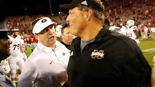 Georgia coach Kirby Smart (left) shakes hands with Mississippi State defensive coordinator Todd Grantham after UGA's win in Athens. (Joshua L. Jones/Athens Banner-Herald via AP)