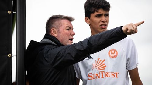 Atlanta United Academy Director Tony Annan gives instructions to Atlanta United academy player Efrain Morales. Morales, a native of Suwanee, has been invited by Manchester United to participate in an eight-day training experience.