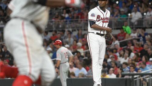 The Phillies’ Odubel Herrera (left) passes Braves pitcher Julio Teheran  as he rounds third base after hitting a two-run homer  in Atlanta on, Aug. 8, 2017, in Atlanta. (AP Photo/John Amis)