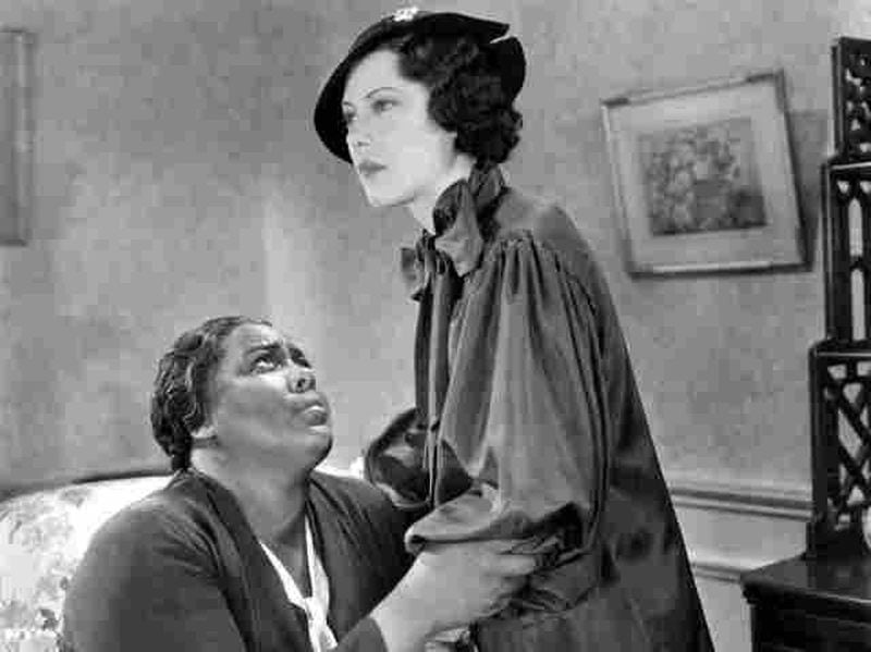 In the 1934 film “Imitation of Life,” Fredi Washington, right, plays the daughter of Louise Beavers, left, and breaks her mother’s heart by passing as a white woman. (Universal Pictures)