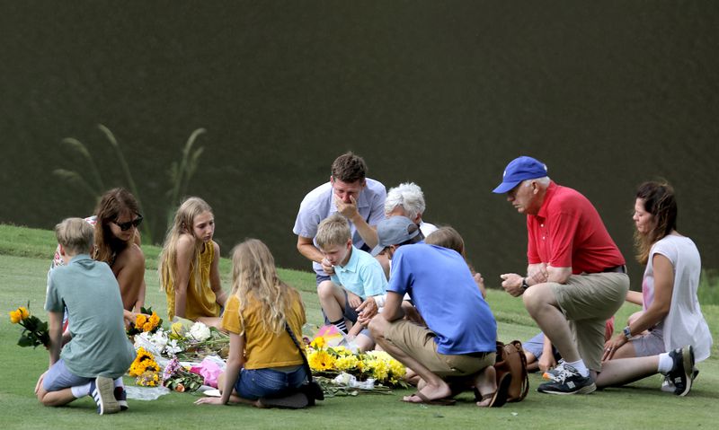 Mourners gathered at a memorial for Gene Siller at Pinetree Country Club in July 2021. 