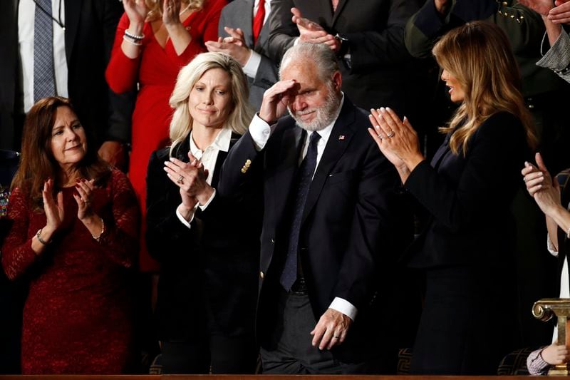Rush Linbaugh reacts as first Lady Melania Trump, second lady Karen Pence, left, and his wife Kathryn, applaud, as President Donald Trump delivers his State of the Union address to a joint session of Congress on Capitol Hill in Washington, Tuesday, Feb. 4, 2020. (AP Photo/Patrick Semansky)