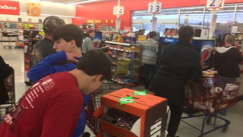 Shoppers pick up last-minute supplies at the Save-a-Lot grocery store in Blue Ridge