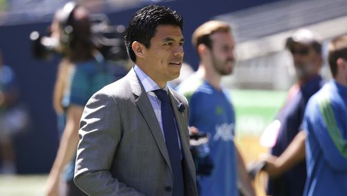 Seattle Sounders assistant coach Gonzalo Pineda, who was filling in for coach Brian Schmetzer, walks on the pitch before the team's exhibition soccer match against Eintracht Frankfurt, Saturday, July 8, 2017, in Seattle. (Ted S. Warren/AP)