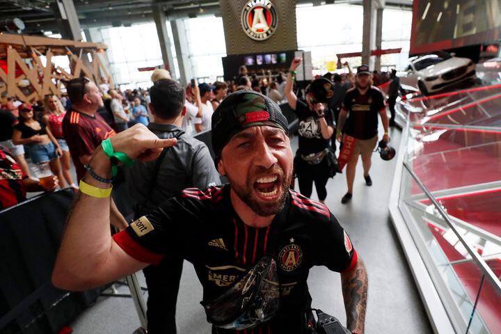 Atlanta United supporters chant as they march toward their section before the game against Orlando on Sunday at Mercedes-Benz Stadium. (Miguel Martinez /Miguel.martinezjimenez@ajc.com)