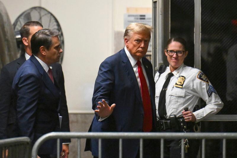 Former President Donald Trump gives a thumbs up as he returns to the courtroom after a break during the first day of his trial at Manhattan Criminal Court in New York, on Monday, April 15, 2024. Trump's hush money trial begins Monday with jury selection. It's a singular moment for American history as the first criminal trial of a former U.S. commander in chief. (Angela Weiss/Pool Photo via AP)