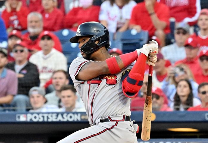 Atlanta Braves right fielder Ronald Acuna (13) hits a single against the Philadelphia Phillies during the first inning of game three of the National League Division Series at Citizens Bank Park in Philadelphia on Friday, October 14, 2022. (Hyosub Shin / Hyosub.Shin@ajc.com)