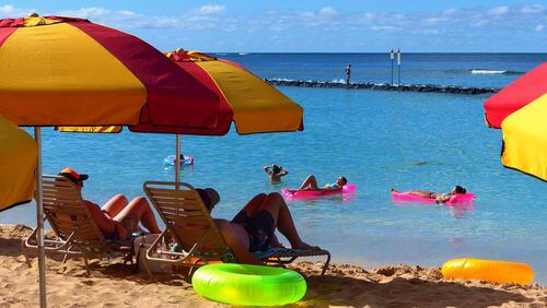 Get a cheap air mattress from the ubiquitous ABC Stores and float in the sun at Kuhio Beach, one of several beaches in Honolulu’s famed Waikiki district. (Brian J. Cantwell/Seattle Times/TNS)