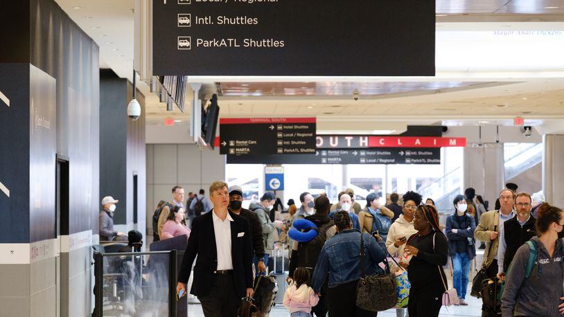 People are seen at Hartsfield-Jackson International Airport domestic terminal in Atlanta on Tuesday, April 19, 2022.  (Arvin Temkar / arvin.temkar@ajc.com)