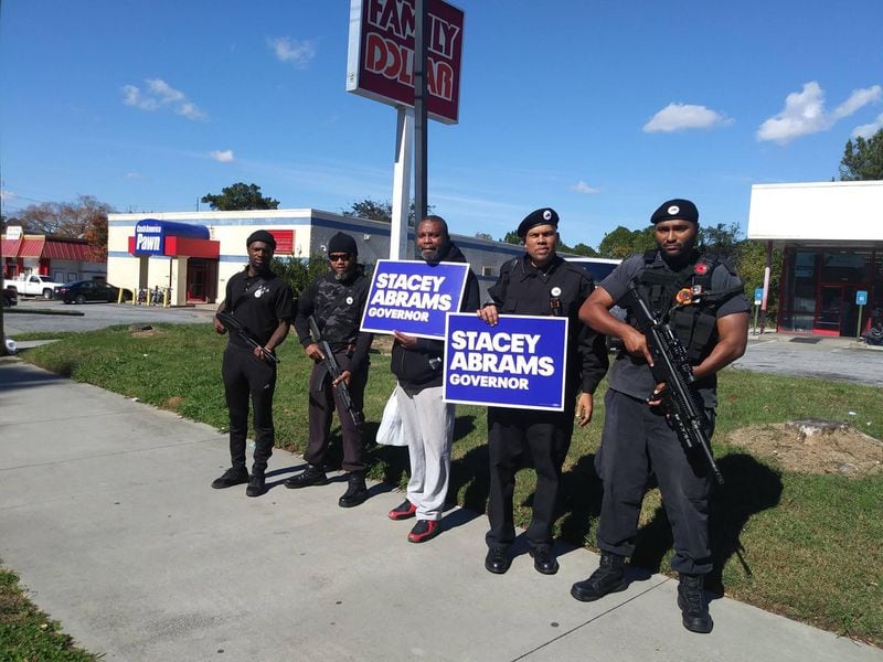 Republican Brian Kemp tweeted this picture of members of the New Black Panther Party campaigning for Democrat Stacey Abrams while carrying firearms in 2018. The group has been vocal in its support for Othal Wallace.