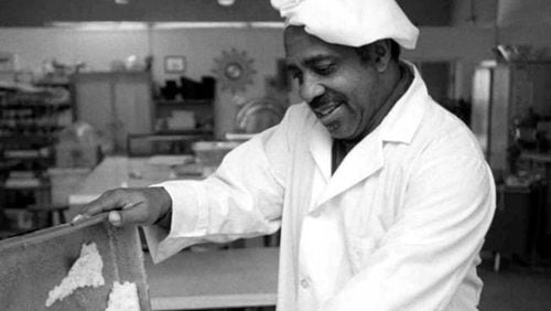 At Mary B. Jordan Catering, Windsor Jordan scrapes newly baked cornbread for Thanksgiving turkey dressing. —-This photo was made at 1971 Howell Mill Road N.W. at the office/kitchen of Mary B. Jordan Catering- in Atlanta, GA. Monday, November 25, 1996. (AJC Staff Photo/Dwight Ross, Jr.)