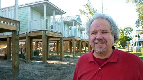 Bruce Tolar is the planner/architect behind Decatur’s pilot cottage court development. In the background are some examples of his Mississippi cottages. Courtesy of Bruce Tolar