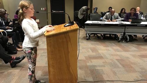 Falyn Handley, 10, a fifth-grader at Springdale Park Elementary School, wears dog-print leggings Monday while asking the Atlanta Board of Education to update the district’s student dress code policy. She collected more than 1,000 signatures on an online petition.
