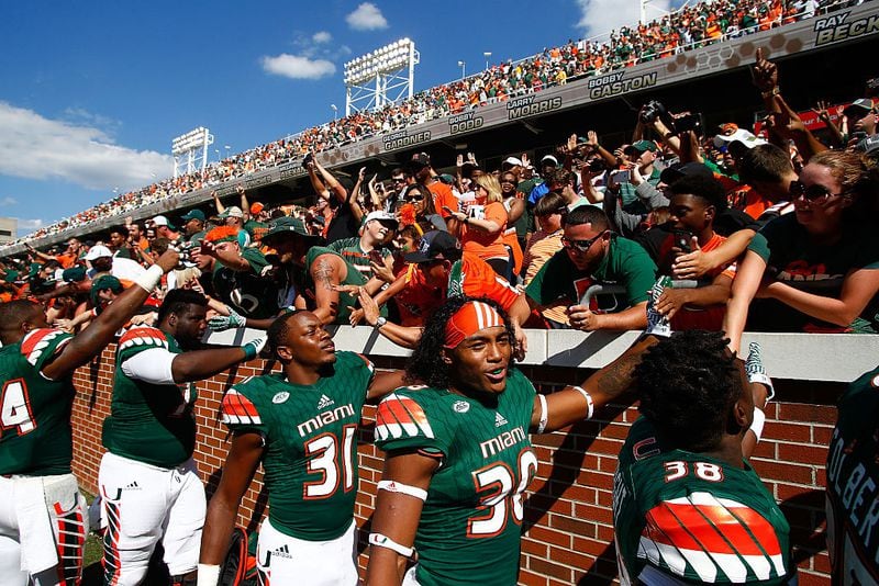 ATLANTA, GA - OCTOBER 01: The Miami Hurricanes celebrate with fans after beating the Georgia Tech Yellow Jackets at Bobby Dodd Stadium on October 1, 2016 in Atlanta, Georgia. Miami won 35-21. (Photo by Daniel Shirey/Getty Images)