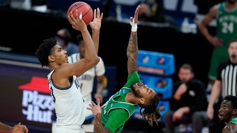 Villanova's Jermaine Samuels (23) shoots over North Texas' James Reese (0) during the first half of their second-round NCAA Tournament game Sunday, March 21, 2021, at Bankers Life Fieldhouse in Indianapolis. (Darron Cummings/AP)