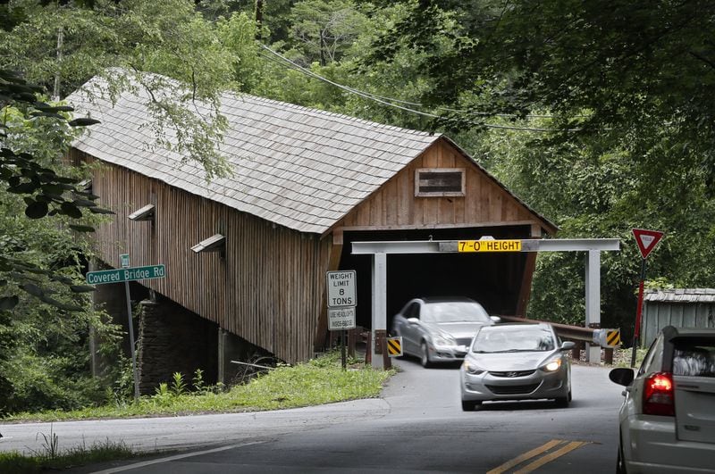 June 20, 2019 - Smyrna - June 20, 2019 - Smyrna - Cobb County’s covered bridge gets a second warning device to stop drivers from running into the historic covered bridge on Concord Road. It will join the older warning device seen here, which is made of steel beams to absorb a blow from a too-tall vehicle. Bob Andres / bandres@ajc.com