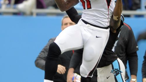Atlanta Falcons’ Julio Jones (11) catches a pass against the Carolina Panthers in the first half of an NFL football game in Charlotte, N.C., Sunday, Nov. 16, 2014. (AP Photo/Mike McCarn)