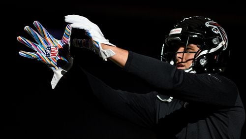 Falcons tight end Austin Hooper wears the Crucial Catch NFL gloves during warms up prior to the game Oct. 6, 2019, against the Texans at NRG Stadium in Houston.