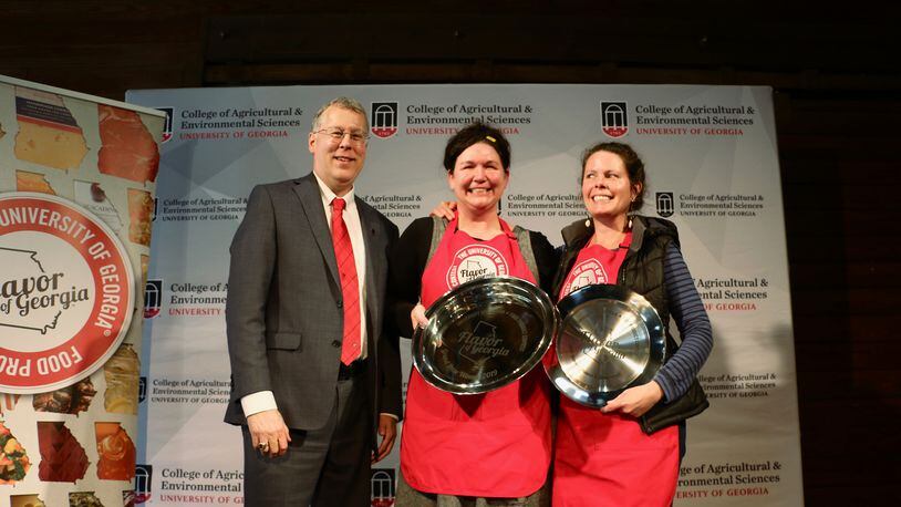 College of Agricultural and Environmental Sciences Dean Sam Pardue congratulates Suzy Sheffield of Atlanta's Beautiful Briny Sea and Holly Hollifield on their grand prize win at Flavor of Georgia 2019.