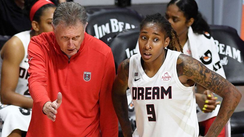 Atlanta Dream coach Mike Petersen talks with forward Crystal Bradford during a break in the team's WNBA game against the Connecticut Sun Friday, July 9, 2021, in Uncasville, Conn. (Sean D. Elliot/The Day)