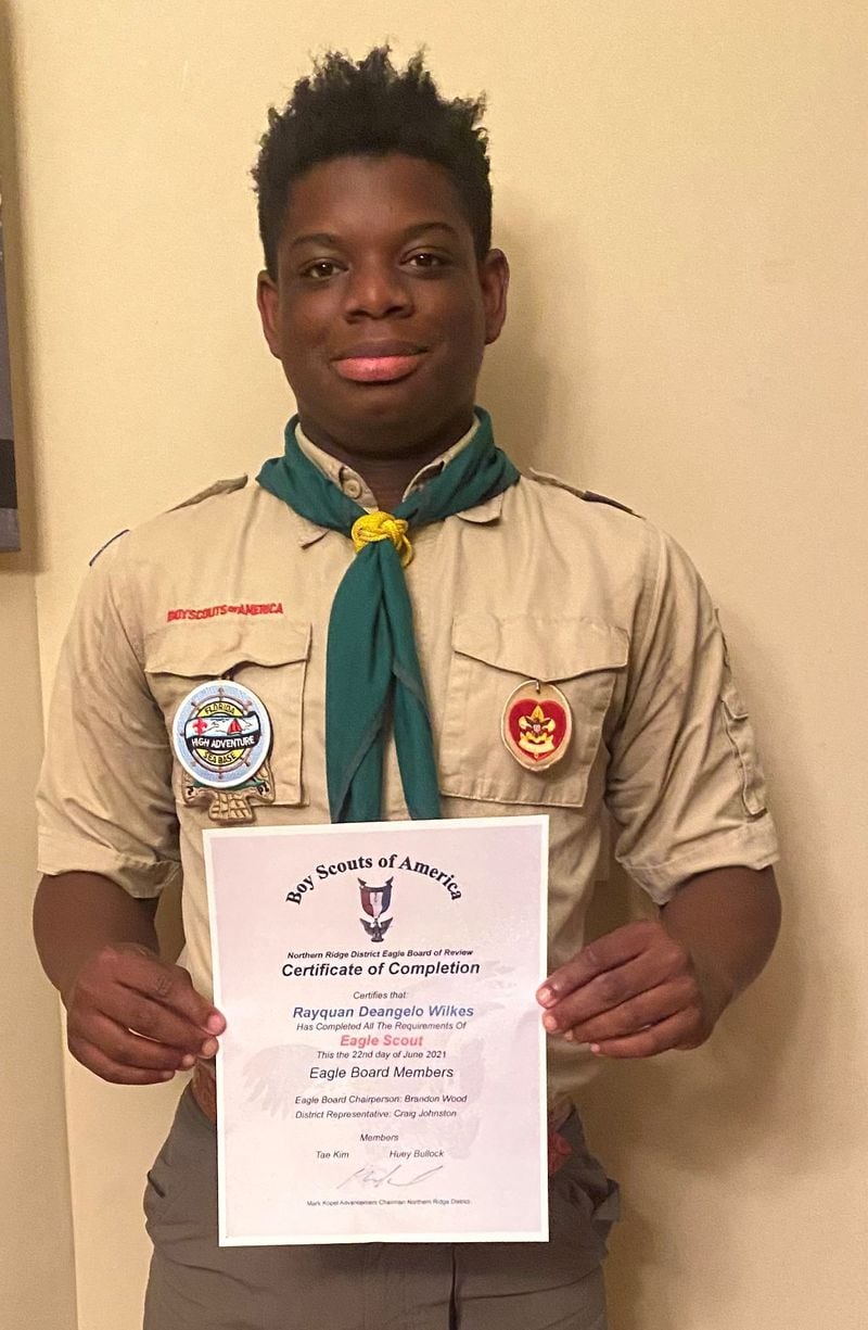 The Northern Ridge Boy Scout District (Cities of Roswell, Alpharetta, John’s Creek, Milton) announced Rayquan Wilkes, of Troop 43, passed his Board of Review on June 22 to become an Eagle Scout. Sponsored by Saint David’s Episcopal Church, his project was the Renovation of the Sinclair House Outdoor Activities Area of St. David’s Episcopal Church.  The renovations included; scrubbing the tops of the benches and the picnic tables and then constructing a backrest for the benches. Rayquan also applied varnish to the 13 benches and 2 picnic tables and planted 2 shrubs on both sides of the stage.