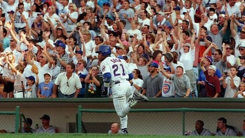The Chicago Cubs' Sammy Sosa watches as his 62nd home run of the season sails over the fence against the Milwaukee Brewers at Wrigley Field in Chicago on September 13, 1998. (Phil Velasquez/Chicago Tribune/TNS)