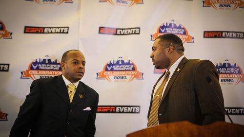 Grambling State coach Broderick Fobbs (left) and North Carolina Central coach Jerry Mack talk to each other following the Celebration Bowl news conference Dec. 8, 2016. (Candace Ledbetter/ Liquid Soul)