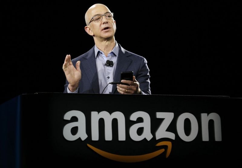 Amazon CEO Jeff Bezos demonstrates the new Amazon Fire Phone, in Seattle in 2014. Atlanta is one of 20 cities named to the shortlist for the company’s second headquarters project. (AP Photo/Ted S. Warren, File)