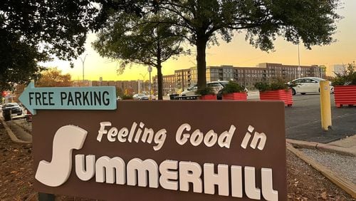 The Summerhill neighborhood has blossomed now that the acres and acres of land once reserved for Braves parking can be developed. In the background are the 565 Hank luxury apartments. (Photo by Bill Torpy)