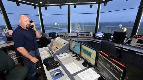 Bill Masseth, an air traffic controller at Springfield Beckley Municipal Airport, at work in the airport’s traffic control tower in 2013. Bill Lackey/Staff