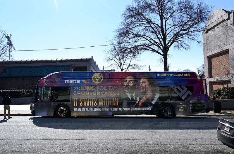 A Marta bus wrapped with 2024 King Holiday Observance theme is seen outside The King Center, Thursday, December 4, 2024, in Atlanta. (Hyosub Shin / Hyosub.Shin@ajc.com)