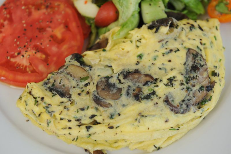 Southern Bistro Mushroom and Herb Omelet with a petite simple green salad. BECKY STEIN PHOTOGRAPHY