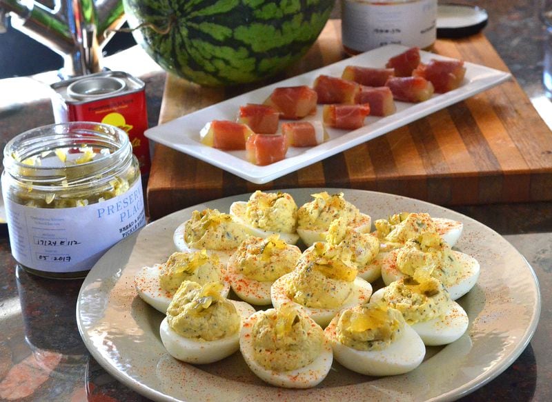 Deviled eggs (in the background are watermelon rind pickles wrapped in prosciutto. Styling by Conne Ward Cameron. (Chris Hunt/Special) 
