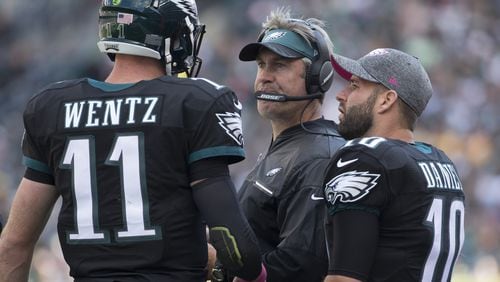 PHILADELPHIA, PA - OCTOBER 23: Head coach Doug Pederson of the Philadelphia Eagles talks to Carson Wentz #11 and Chase Daniel #10 during a timeout in the game against the Minnesota Vikings at Lincoln Financial Field on October 23, 2016 in Philadelphia, Pennsylvania. The Eagles defeated the Vikings 21-10. (Photo by Mitchell Leff/Getty Images)