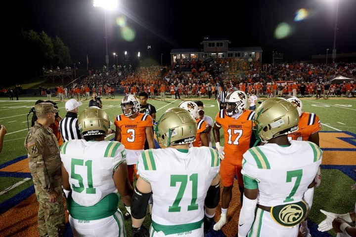 August 20, 2021 - Kennesaw, Ga: North Cobb vs Buford gather for the coin toss before their game at North Cobb high school Friday, August 20, 2021 in Kennesaw, Ga.. JASON GETZ FOR THE ATLANTA JOURNAL-CONSTITUTION
