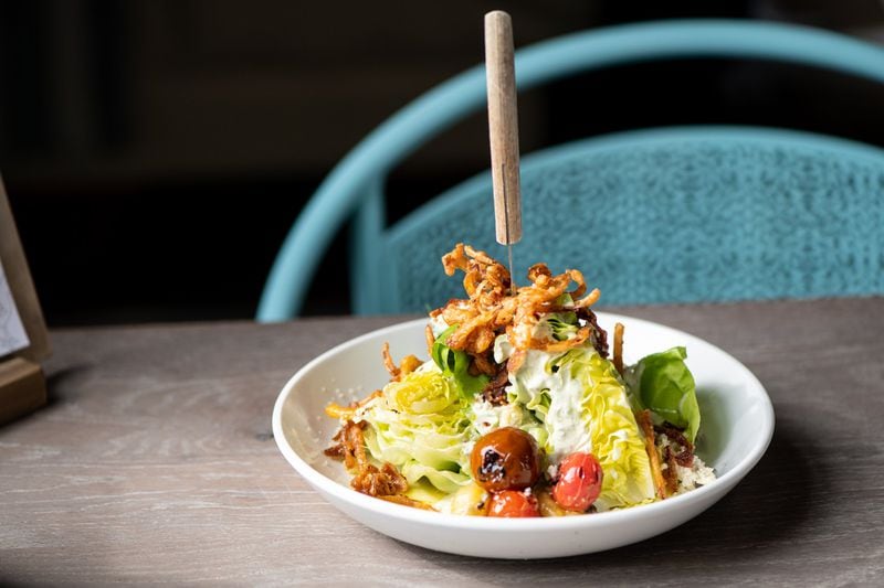 Bibb Lettuce Wedge Salad with roasted tomato, bacon, Clemson blue, french fried onions, and green goddess. Photo credit- Mia Yakel.