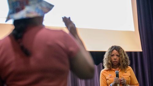 U.S. Rep. Lucy McBath, D-Marietta, takes a question from Gwendolyn Farris during a town hall at Dunwoody High School on Saturday. Branden Camp/Special