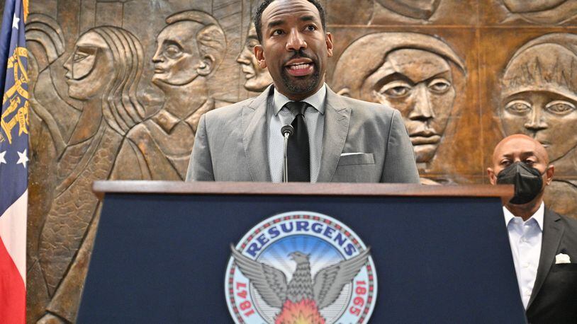 February 3, 2022 Atlanta - Mayor Andre Dickens announces the settlement with Integral Group CEO Egbert Perry (not pictured) and the Atlanta Housing Authority President Eugene Jones (right) during a press conference at Atlanta City Hall on Thursday, February 3, 2022. (Hyosub Shin / Hyosub.Shin@ajc.com)