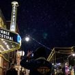 People take photos beneath the marquee of the Egyptian Theater during the Sundance Film Festival on Jan. 22, 2020, in Park City, Utah. (Kent Nishimura/Los Angeles Times/TNS)