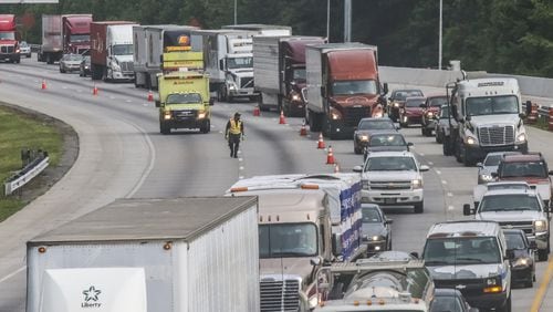 File Photo: Earlier this year, a tractor-trailer hauling 19 cows overturned on I-75 South in Cobb County, causing the road to be temporarily shut. JOHN SPINK/JSPINK@AJC.COM
