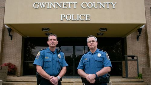Gwinnett County Chief of Police Tom Doran and former Gwinnett County Chief of Police Butch Ayers pose outside of the Gwinnett County Police Headquarters in Lawrenceville, Georgia. (Photo/Rebecca Wright for the Atlanta Journal-Constitution) AJC FILE PHOTO
