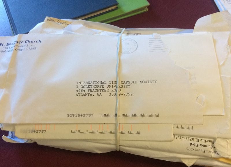 A thick sheaf of envelopes filled with time capsule registration forms submitted to the International Time Capsule Society. There’s now an online version of the form that automatically inputs info to a spreadsheet; these “unprocessed” forms, some of which date back to the early to mid-1990s, are carefully held in the Archives and Special Collections area of the library at Oglethorpe University. JILL VEJNOSKA/ JVEJNOSKA@AJC.COM