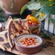 Ela offers three hummus options, including this one featuring crispy chickpeas and sumac. The trio also is available as a $15 sampler, with grilled pita. Courtesy of Frankie Cole