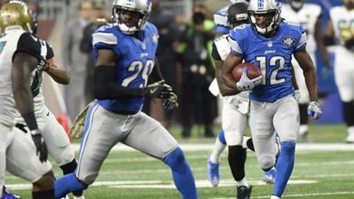 Detroit Lions wide receiver Andre Roberts (12) returns a punt return for a 55-yard touchdown during the first half of an NFL football game against the Jacksonville Jaguars, Sunday, Nov. 20, 2016 in Detroit. (AP Photo/Jose Juarez)