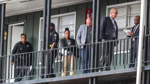 Atlanta police detectives swarm an apartment on Donnelly Avenue. A man died following a shooting at the complex.