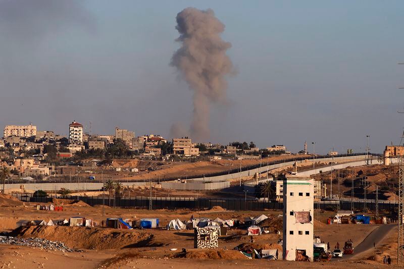 Smoke rises following an Israeli airstrike on buildings near the separating wall between Egypt and Rafah, southern Gaza Strip, Monday, May 6, 2024. (AP Photo/Ramez Habboub)