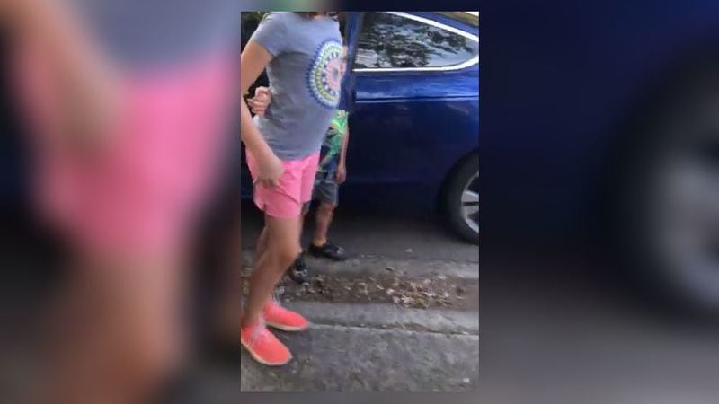 Two children are seen in a Facebook live video being questioned by a Cobb County police officer. (Photo: Facebook)
