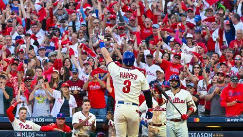 Philadelphia Phillies designated hitter Bryce Harper (3) celebrates a solo home run against the Atlanta Braves during the eighth inning of game four of the National League Division Series at Citizens Bank Park in Philadelphia on Saturday, October 15, 2022. (Hyosub Shin / Hyosub.Shin@ajc.com)