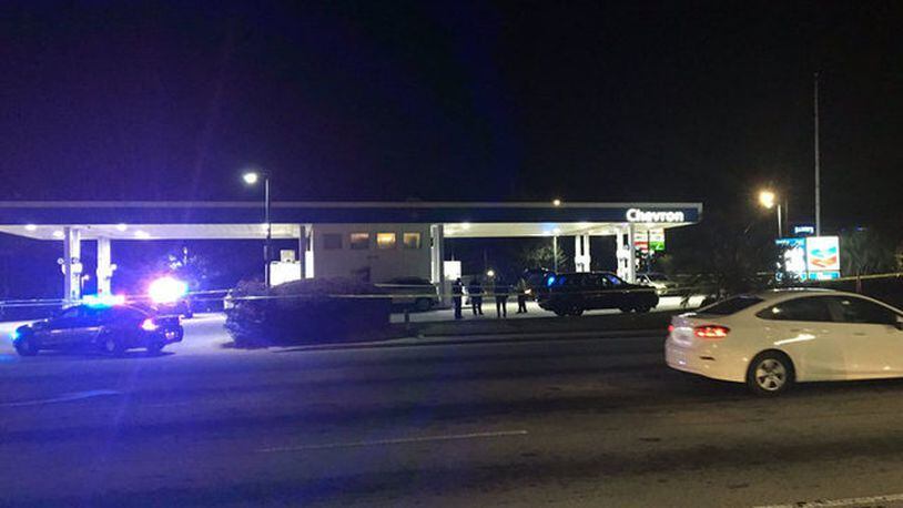 Police are investigating a shootout that left a man dead outside a DeKalb County gas station.